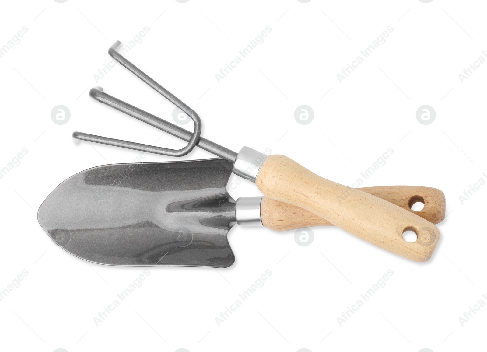 Photo of Gardening trowel and rake isolated on white, top view