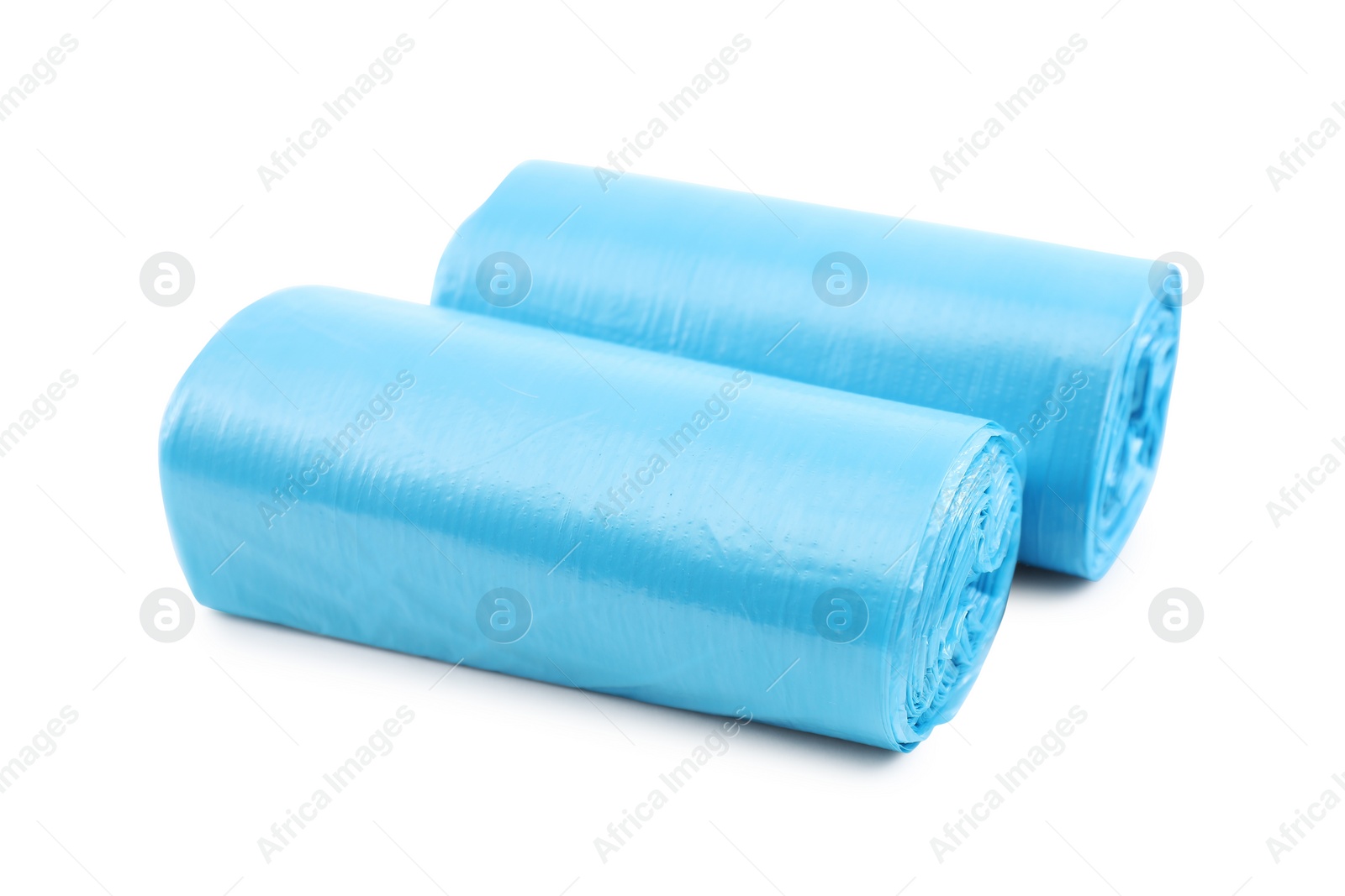 Photo of Two rolls of light blue garbage bags isolated on white