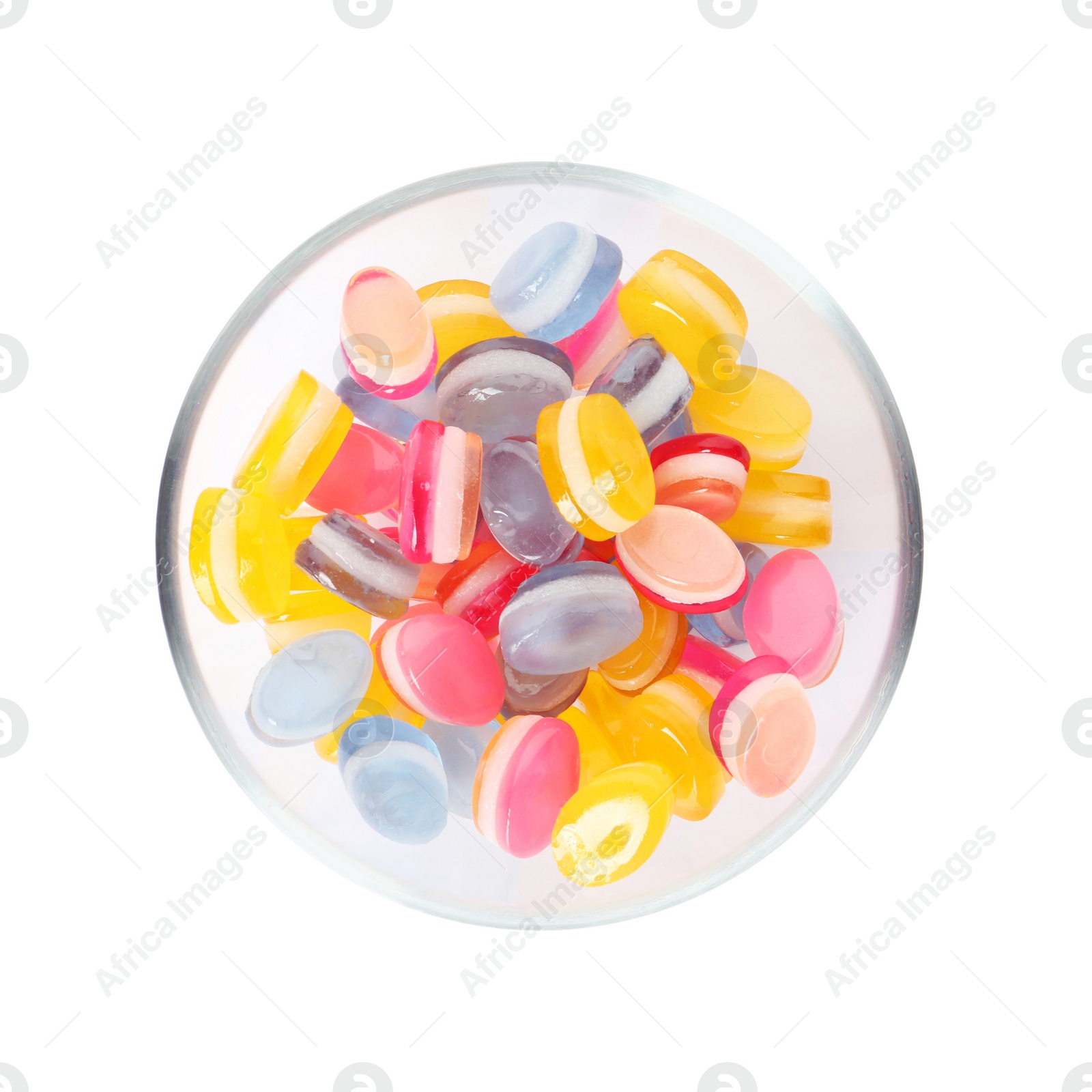 Photo of Tasty colorful sweets in glass bowl isolated on white, top view