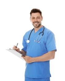 Portrait of smiling male doctor in scrubs with clipboard isolated on white. Medical staff