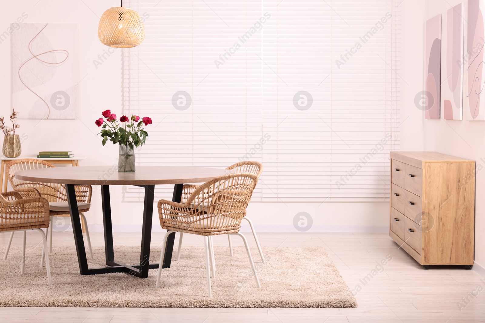 Photo of Stylish dining room interior with comfortable furniture