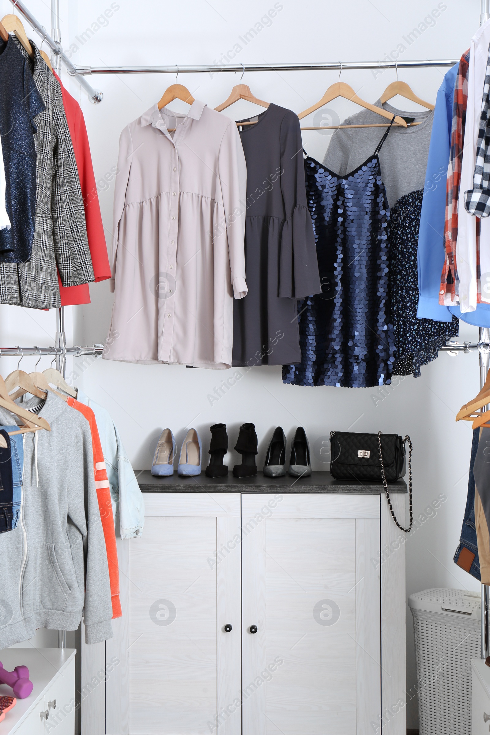Photo of Modern dressing room with different stylish clothes and shoes