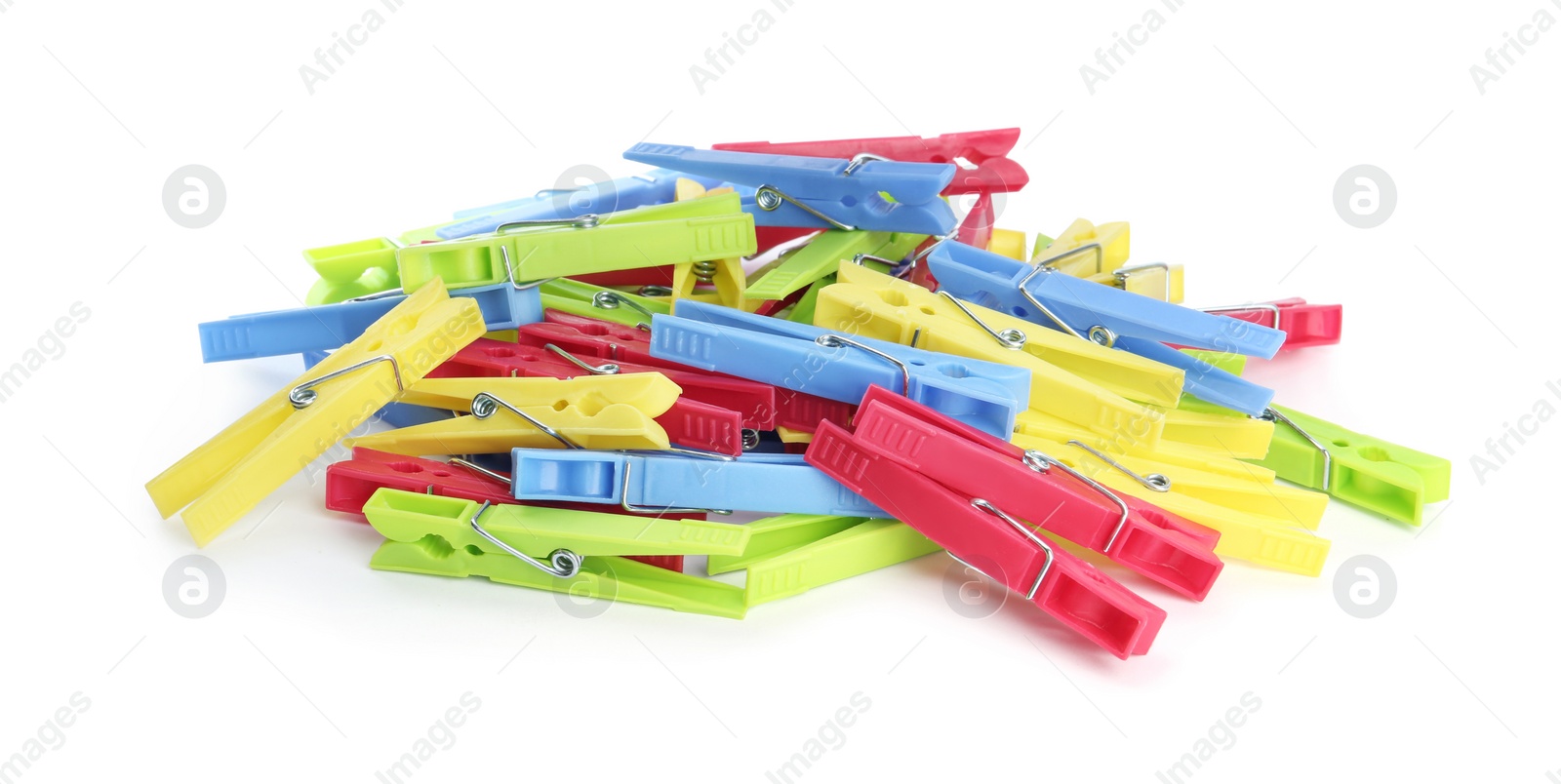 Photo of Many colorful plastic clothespins on white background