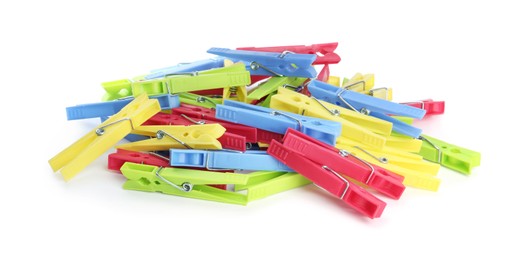 Photo of Many colorful plastic clothespins on white background