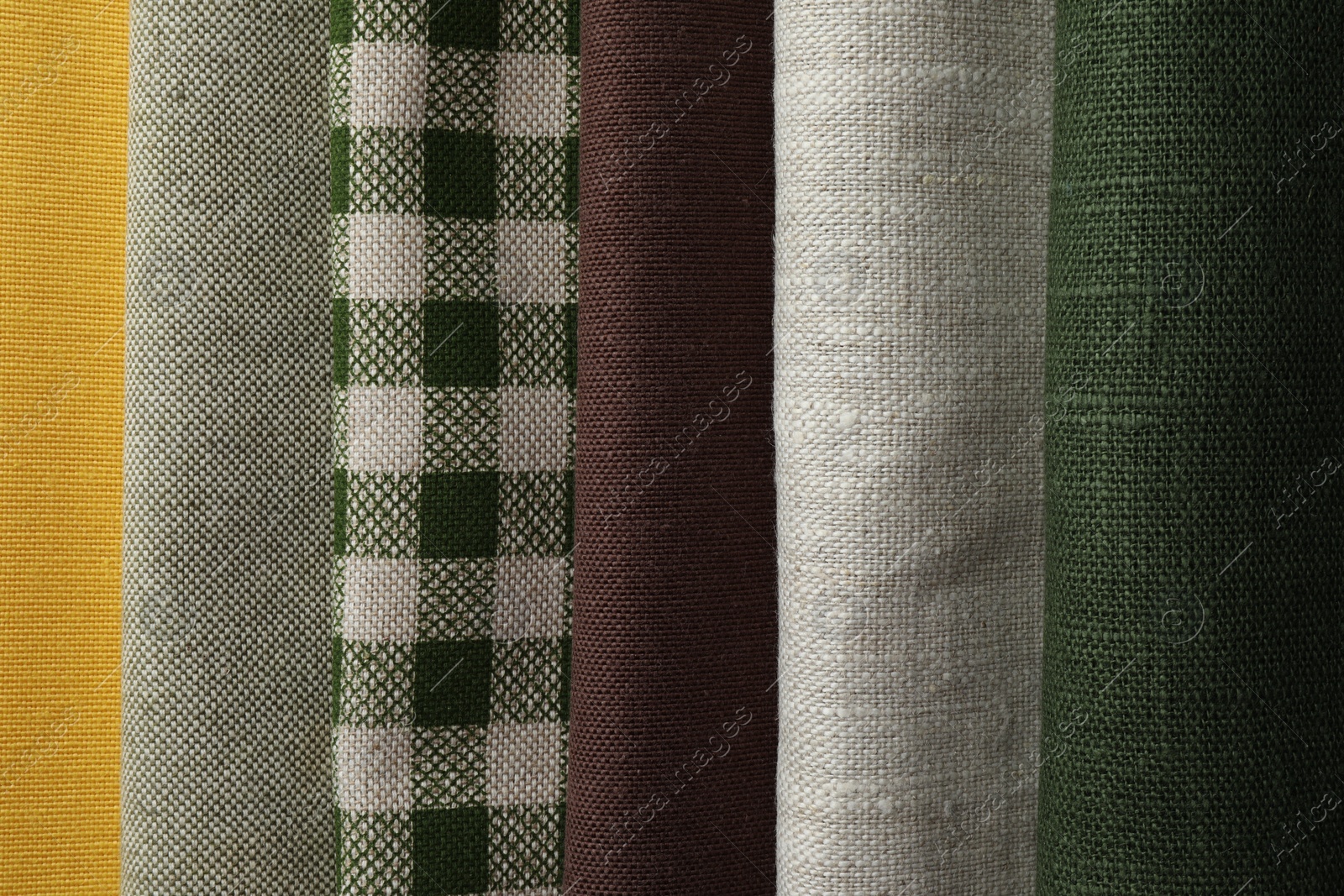 Photo of Many different fabrics as background, top view