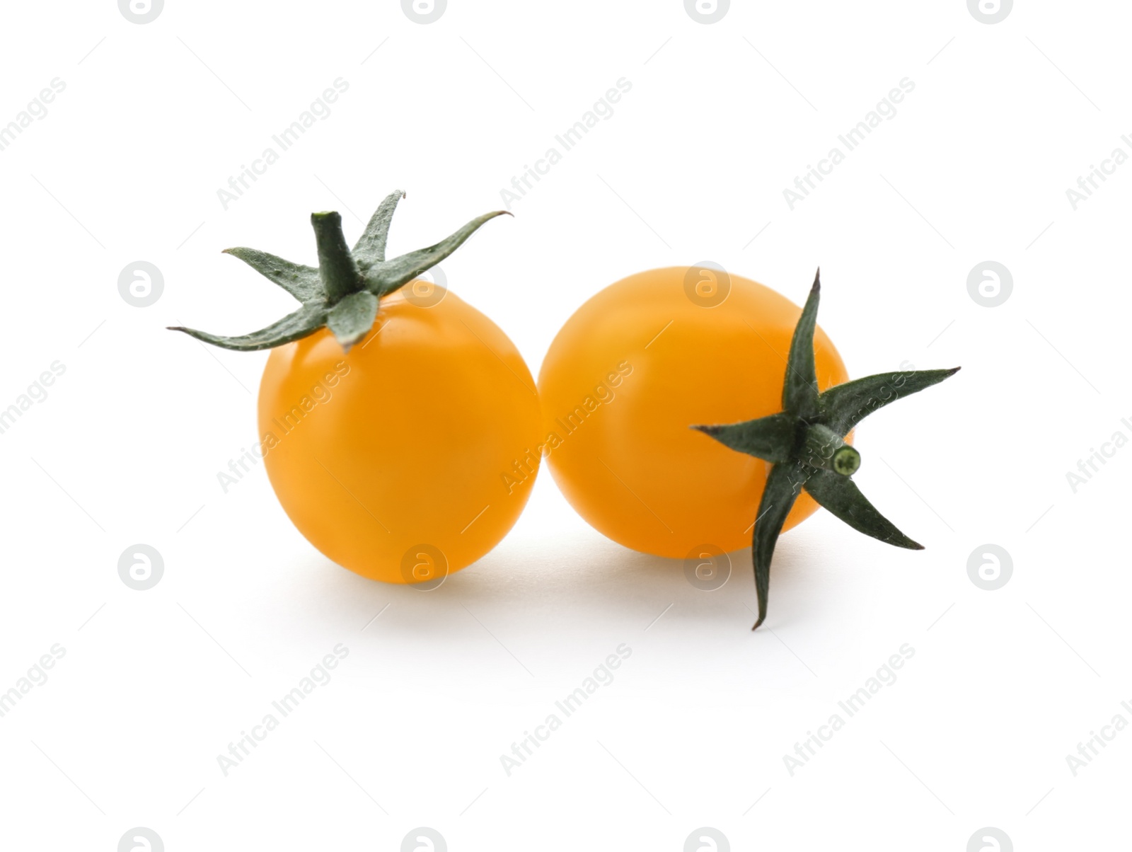 Photo of Ripe yellow cherry tomatoes on white background