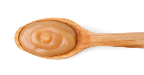 Wooden spoon with tasty salted caramel isolated on white, top view