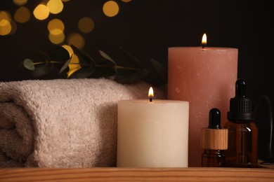 Beautiful composition with different spa products on table against blurred lights, closeup