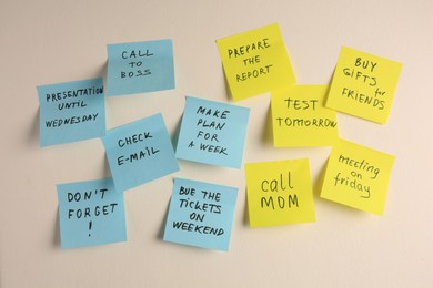 Photo of Many different reminder notes on white wall