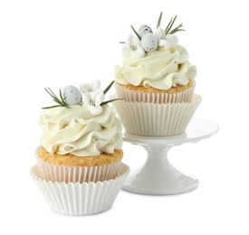 Tasty Easter cupcakes with vanilla cream isolated on white