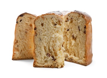 Slices of delicious Panettone cake with powdered sugar on white background. Traditional Italian pastry