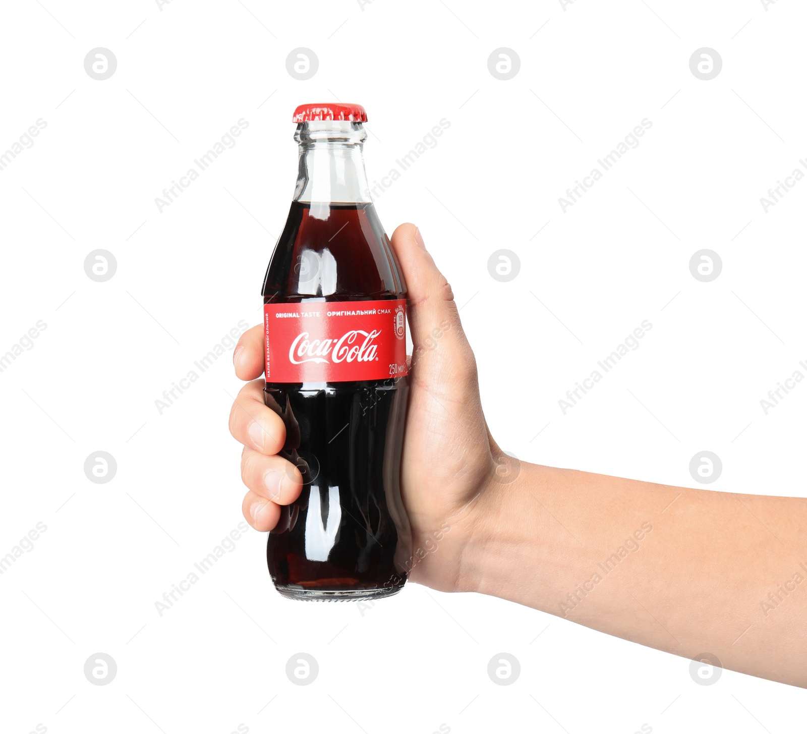 Photo of MYKOLAIV, UKRAINE - NOVEMBER 15, 2018: Man holding bottle of Coca Cola on white background, closeup