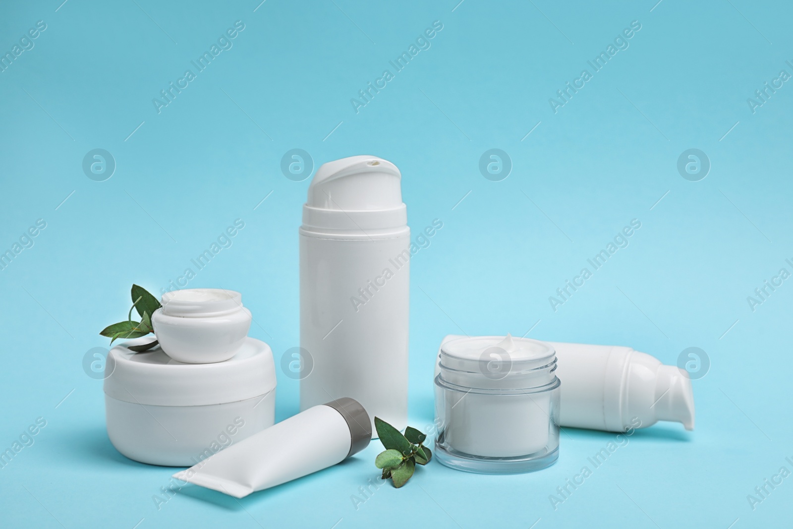 Photo of Composition with cosmetic products on color background