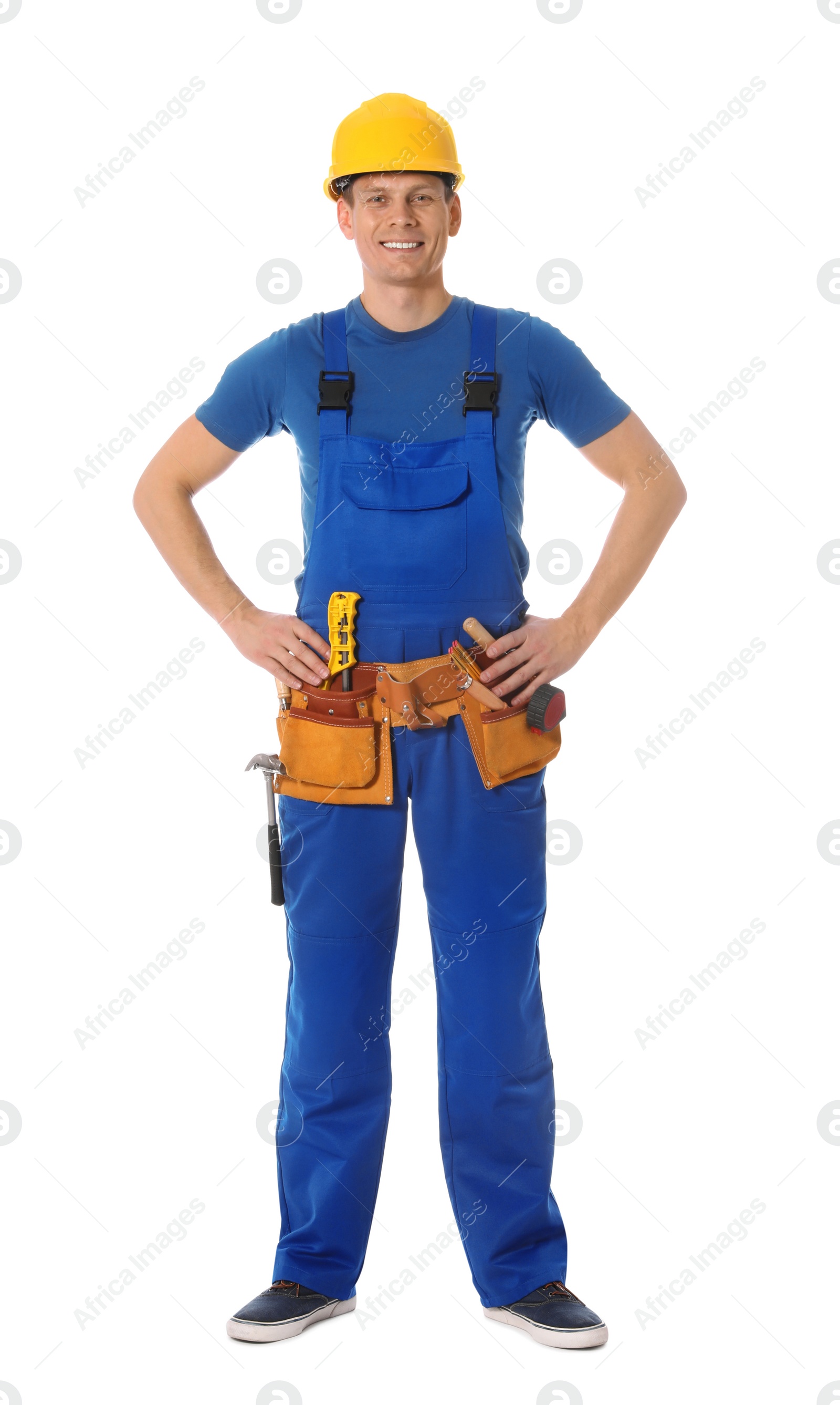 Photo of Handsome carpenter with tool belt isolated on white