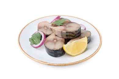 Slices of tasty salted mackerel with lemon and onion isolated on white