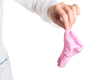 Photo of Doctor with used medical glove on white background