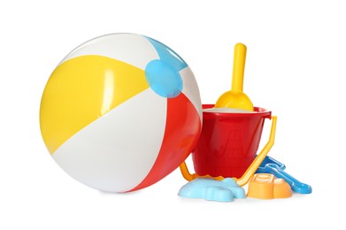 Photo of Inflatable colorful beach ball and sand toys on white background