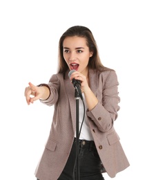 Photo of Young stylish woman singing in microphone on white background