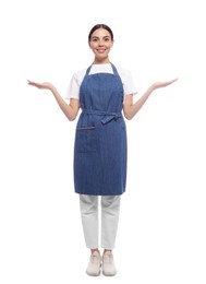 Photo of Young woman in blue jeans apron on white background