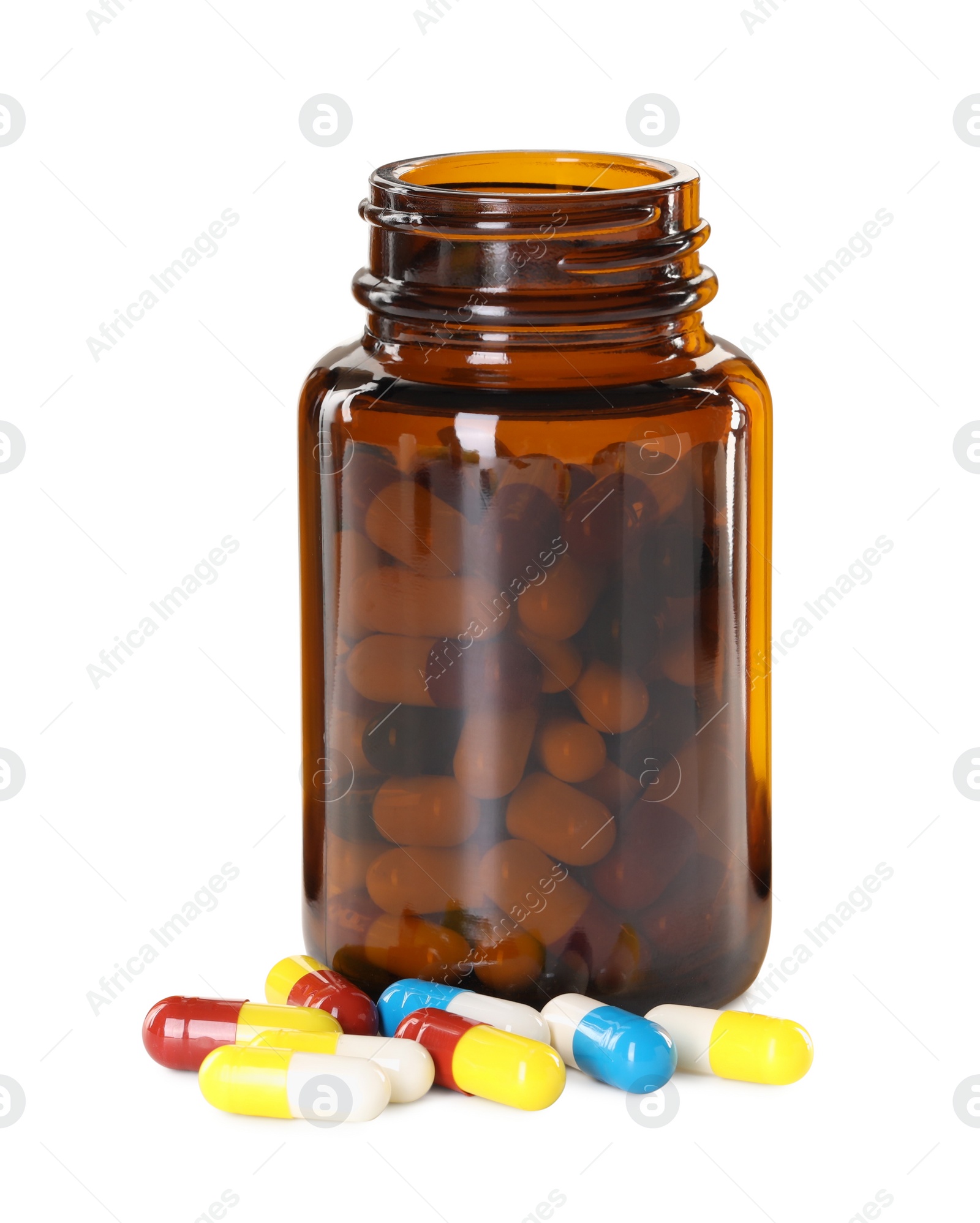 Photo of Antibiotic pills and bottle isolated on white