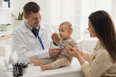 Mother with her cute baby visiting pediatrician in clinic