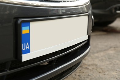 Photo of Car with vehicle registration plate outdoors, closeup