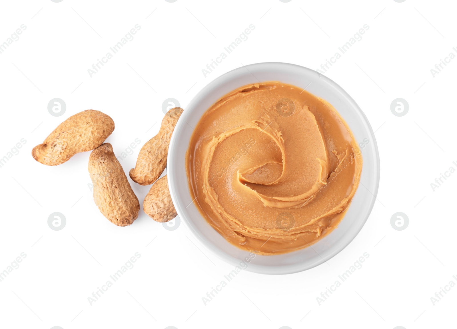 Photo of Bowl with creamy peanut butter on white background