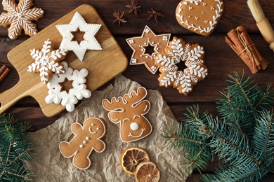 Flat lay composition with delicious homemade Christmas cookies on wooden table