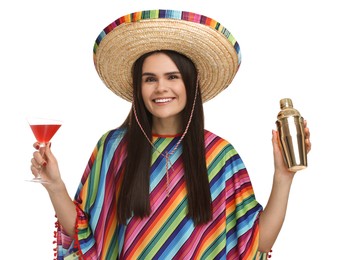 Young woman in Mexican sombrero hat and poncho with shaker and cocktail on white background