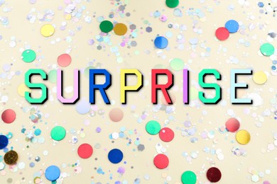 Surprise party. Shiny confetti on light background, above view