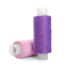 Different colorful sewing threads on white background