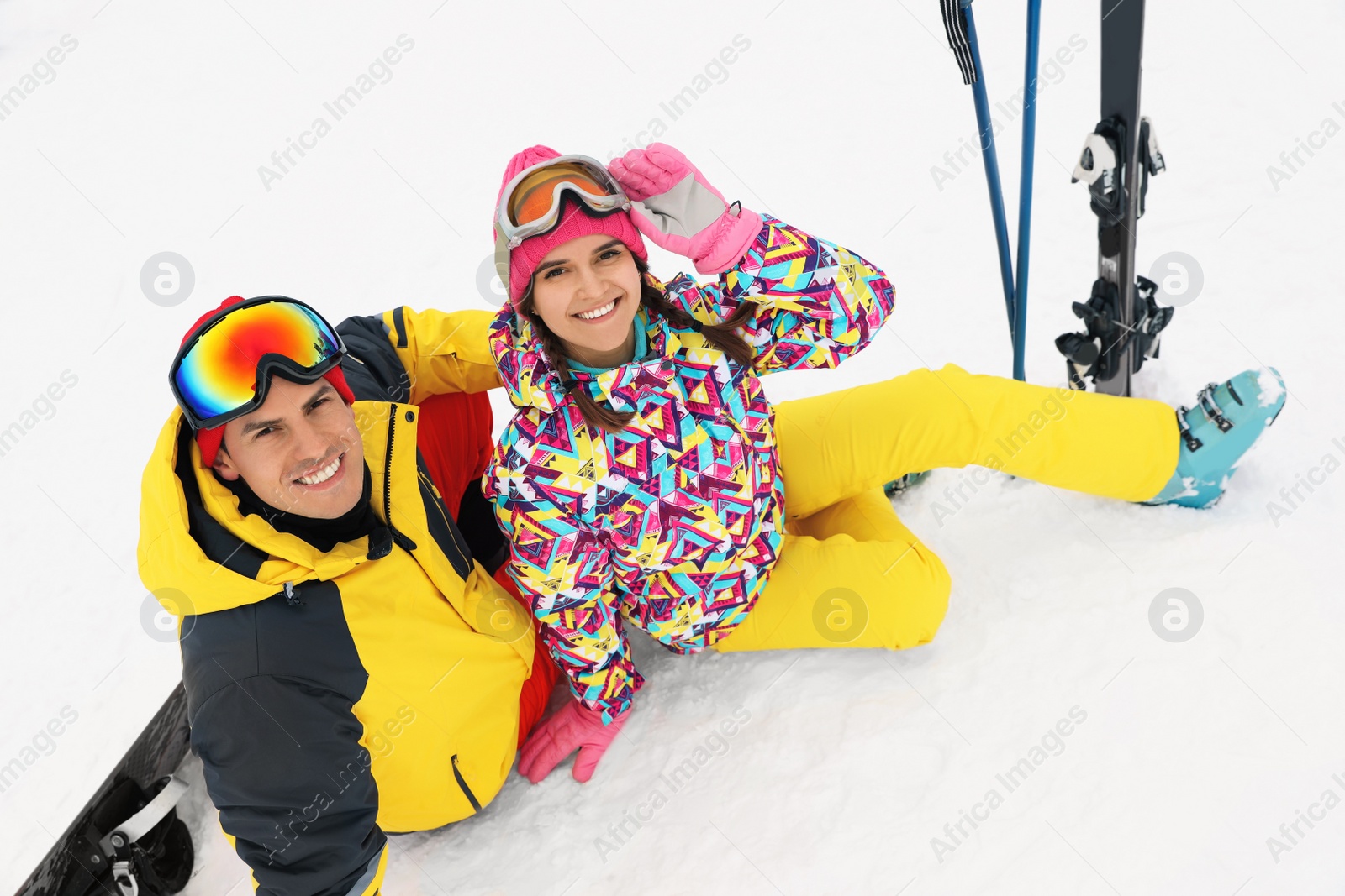 Photo of Lovely couple with equipment at ski resort. Winter vacation