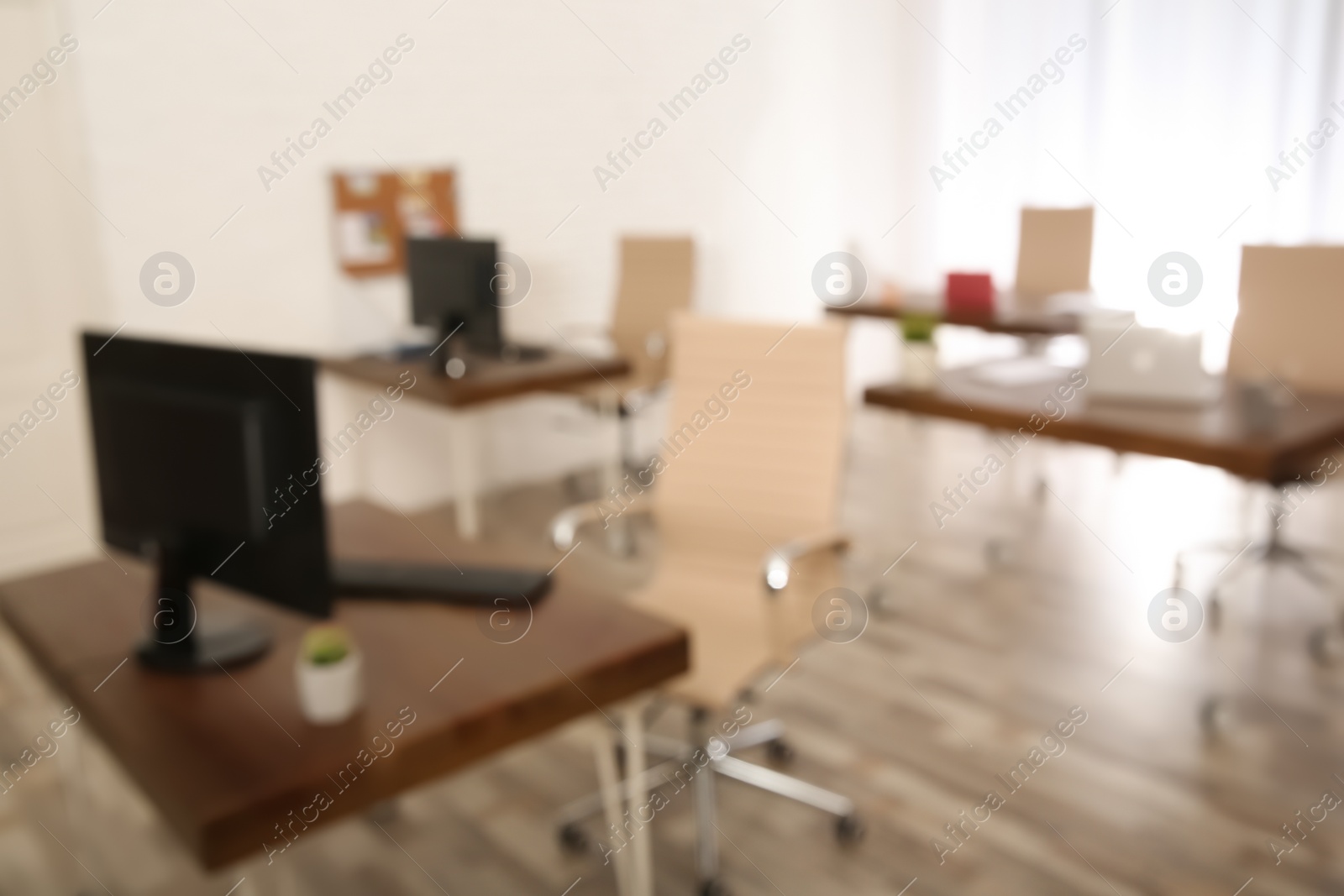 Photo of Modern brightly lit office with bokeh effect