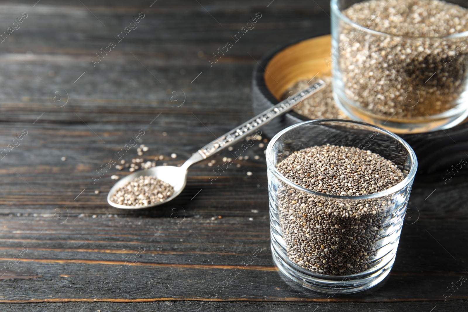 Photo of Composition with chia seeds on wooden background. Space for text