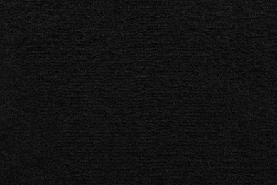 Texture of black car floor carpet as background, top view