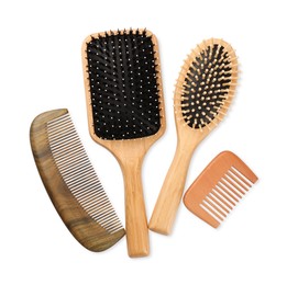 Set of hair brushes and combs isolated on white, top view