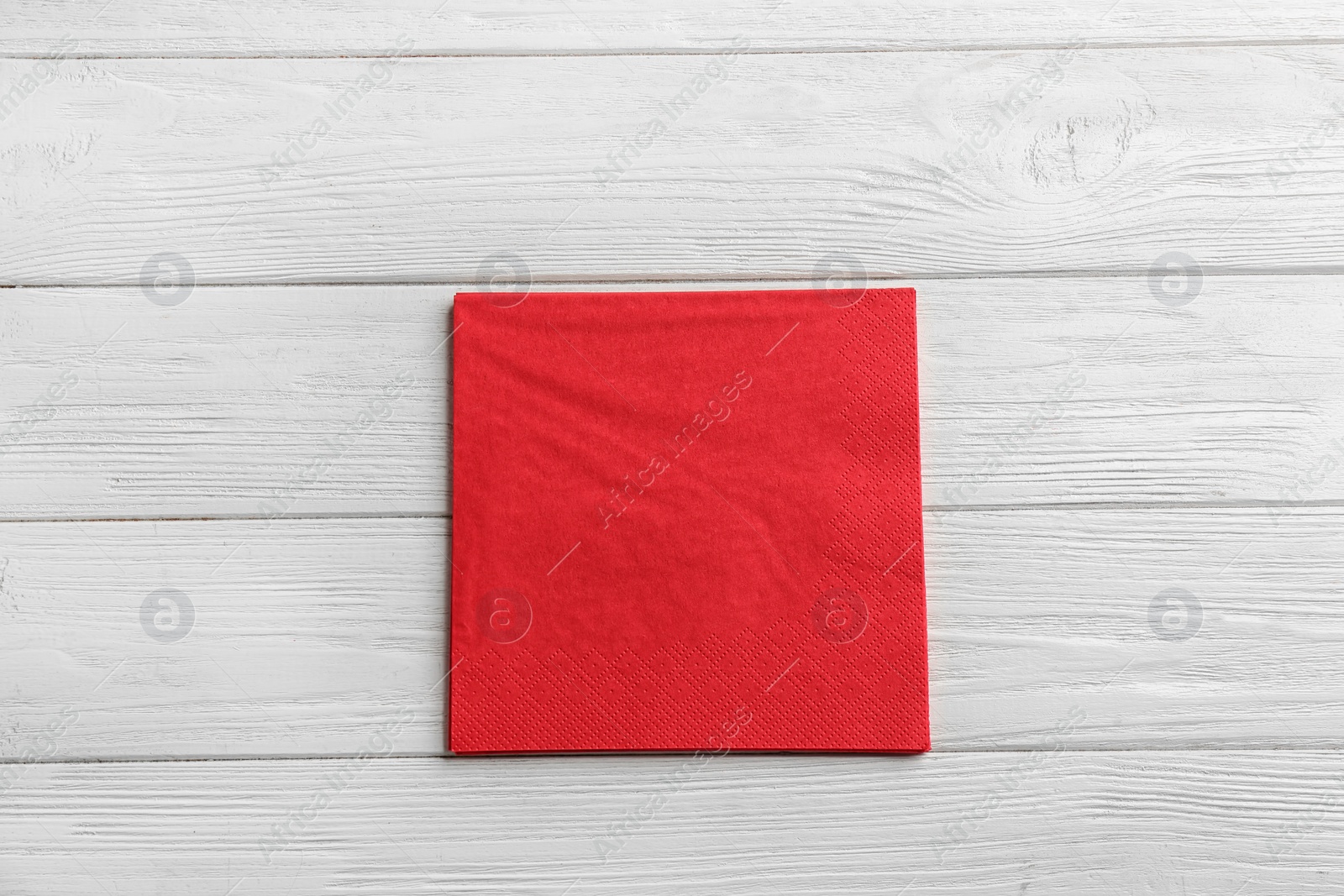 Photo of Clean napkins on wooden background, top view. Personal hygiene