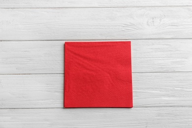 Photo of Clean napkins on wooden background, top view. Personal hygiene