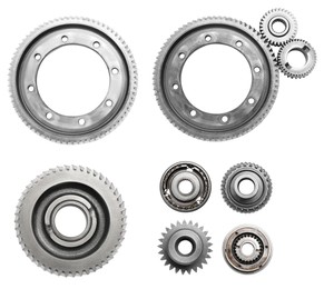 Set with different stainless steel gears on white background, top view