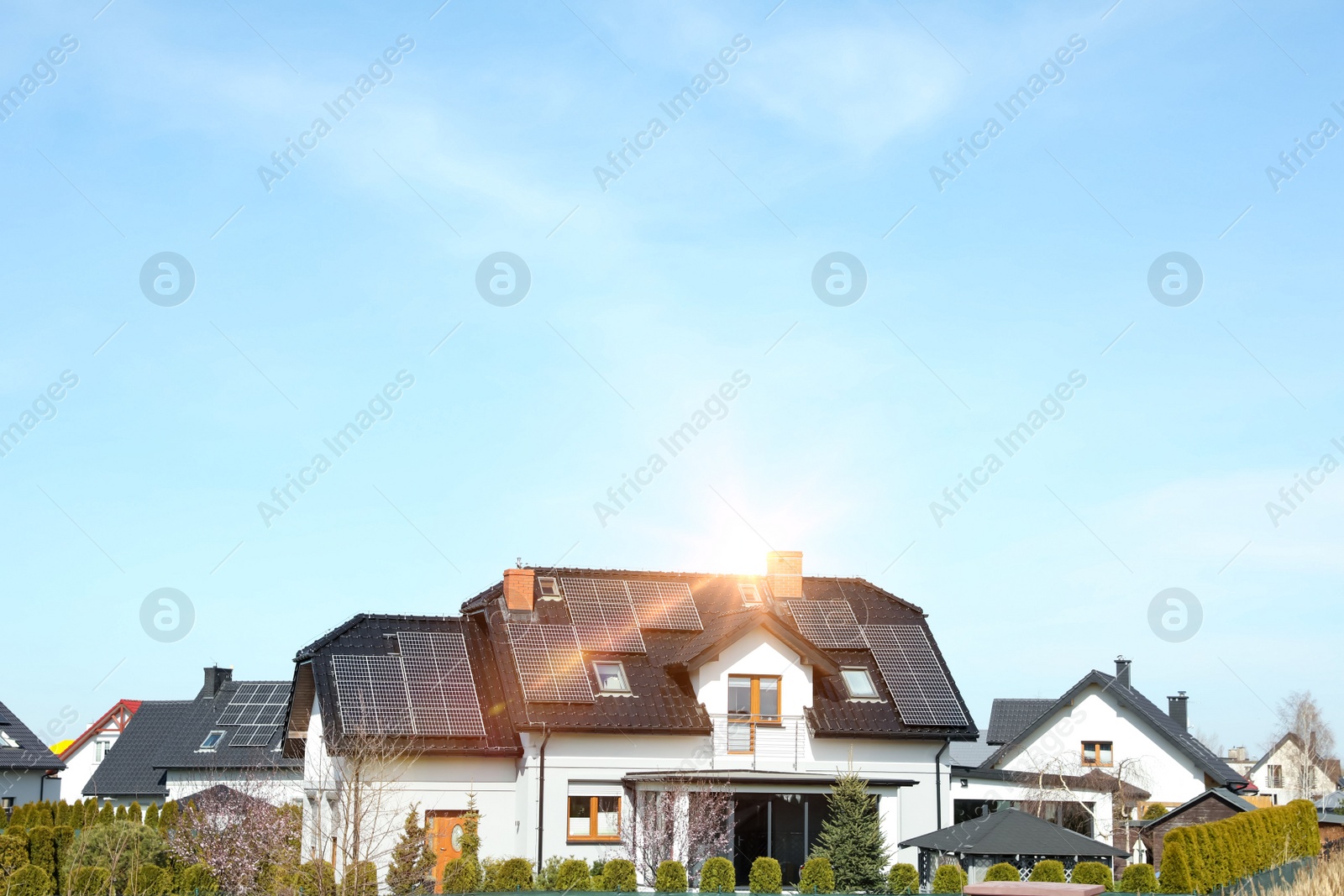 Photo of House with installed solar panels on roof, space for text. Alternative energy