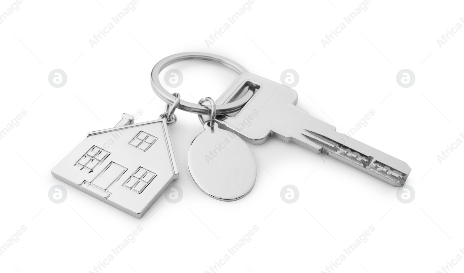 Photo of Key with metallic keychain in shape of house isolated on white