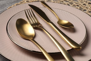 Stylish table setting with cutlery on grey background, closeup view