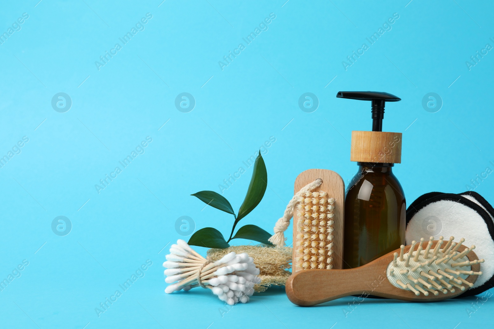 Photo of Composition with eco friendly products on light blue background, space for text. Conscious consumption