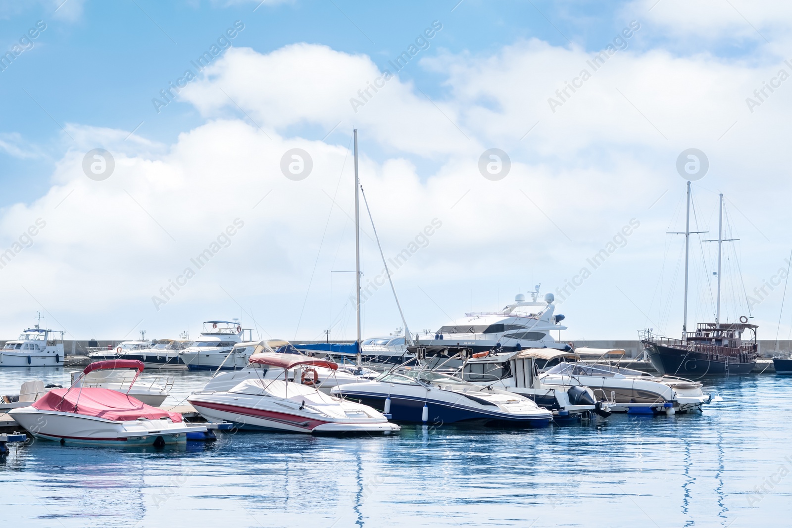 Photo of Beautiful view of city pier with moored boats on sunny day