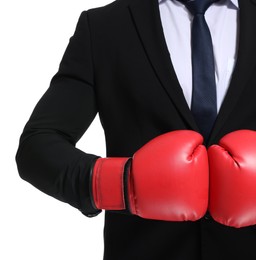 Photo of Businessman in suit wearing boxing gloves on white background, closeup