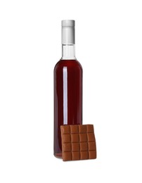 Delicious syrup for coffee and caramel candies on white background