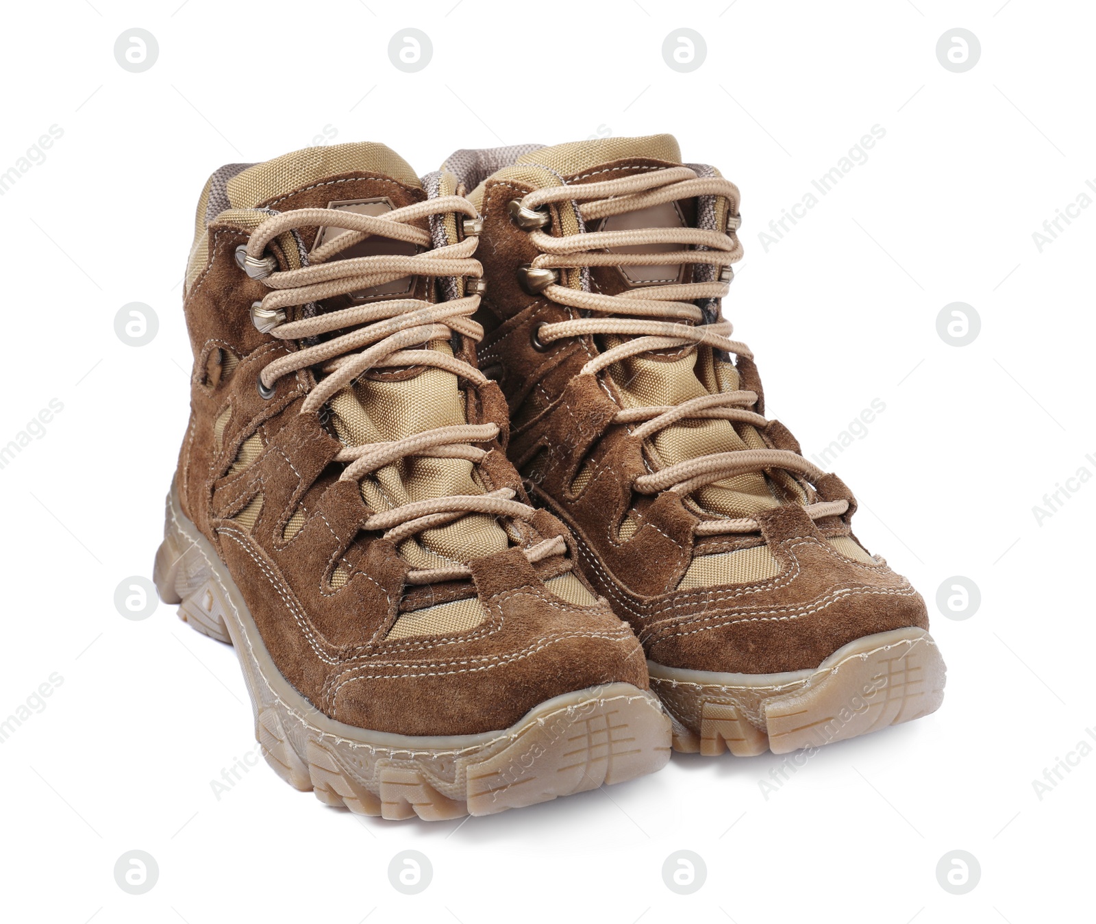 Photo of Pair of comfortable hiking boots on white background. Camping tourism