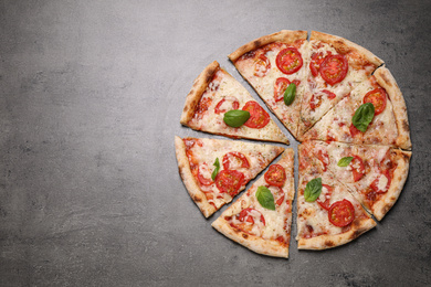 Delicious pizza Margherita on grey table, flat lay. Space for text