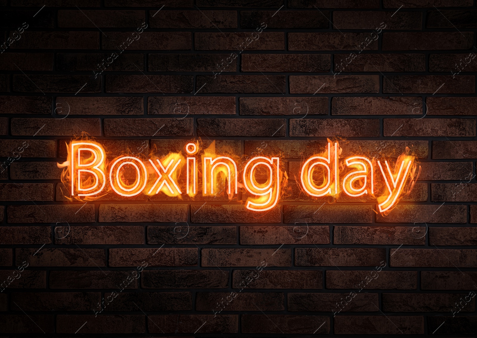 Image of Flaming text Boxing Day against brick wall