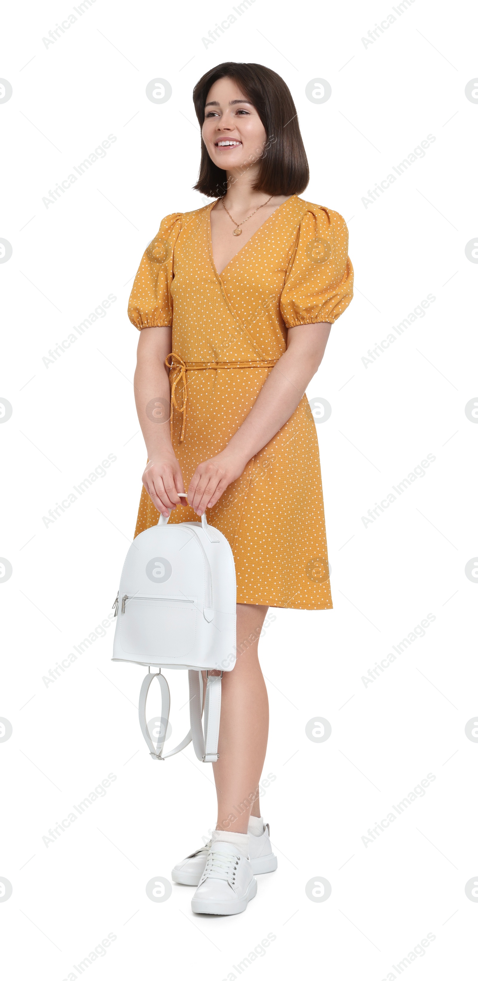 Photo of Happy woman in beautiful dress with backpack on white background